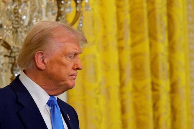 U.S. President Donald Trump reacts during a press conference with French President Emmanuel Macron (not pictured) at the White House in Washington, D.C., U.S., February 24, 2025. REUTERS/Brian Snyder