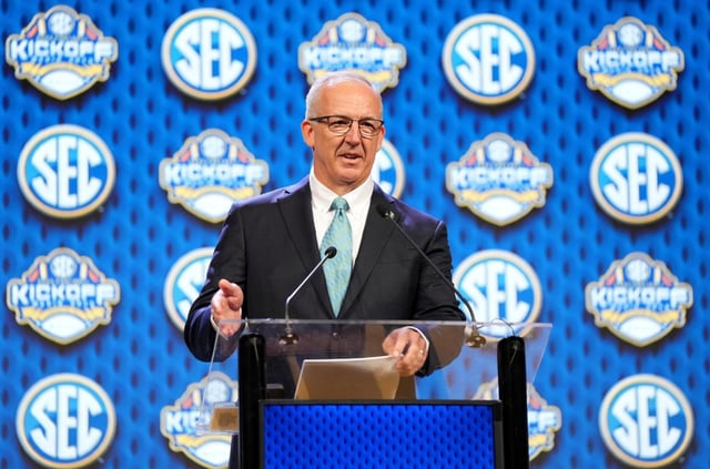 FILE – Southeastern Conference commissioner Greg Sankey speaks during SEC NCAA college football media days, July 15, 2024, in Dallas. (AP Photo/Jeffrey McWhorter, File)