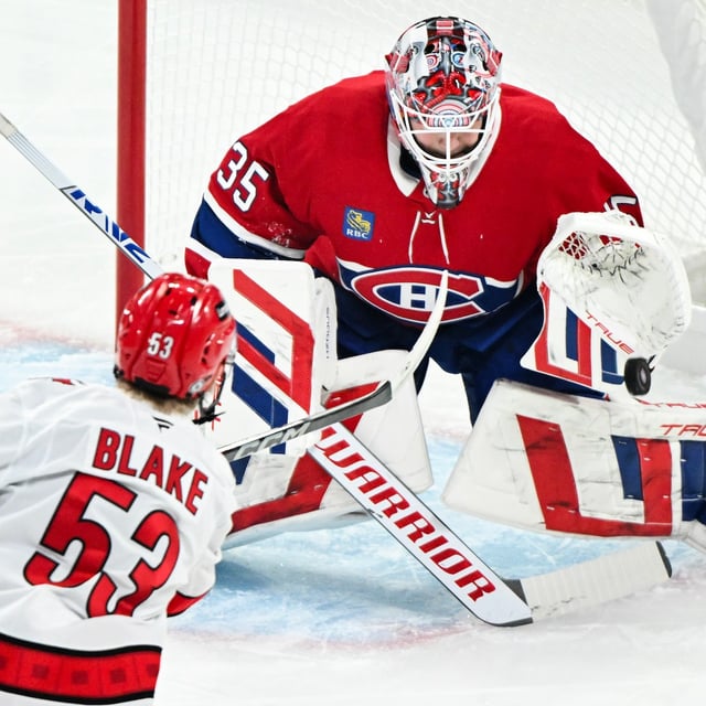 Carolina Hurricanes' Jackson Blake (53) takes a shot on Montreal Canadiens goaltender Sam Montembeault during first period NHL hockey action in Montreal, Tuesday, February 25, 2025. THE CANADIAN PRESS/Graham Hughes