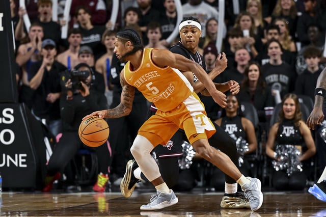 Feb 22, 2025; College Station, Texas, USA; Tennessee Volunteers guard Zakai Zeigler (5) dribbles the ball as Texas A&M Aggies guard Zhuric Phelps (1) defends during the first half at Reed Arena. Mandatory Credit: Maria Lysaker-Imagn Images/File Photo