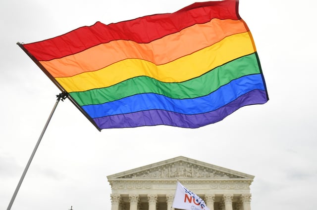 Demonstrators in favor of LGBTQ rights rally outside the U.S, Supreme Court in Washington, DC, on October 8, 2019.