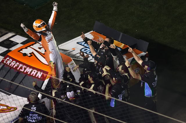 Parker Kligerman, driver of the #75 Spiked Coolers Chevrolet celebrates with his crew after winning the NASCAR Craftsman Truck Series Fresh from Florida 250 at Daytona International Speedway on February 14, 2025 in Daytona Beach, Florida.