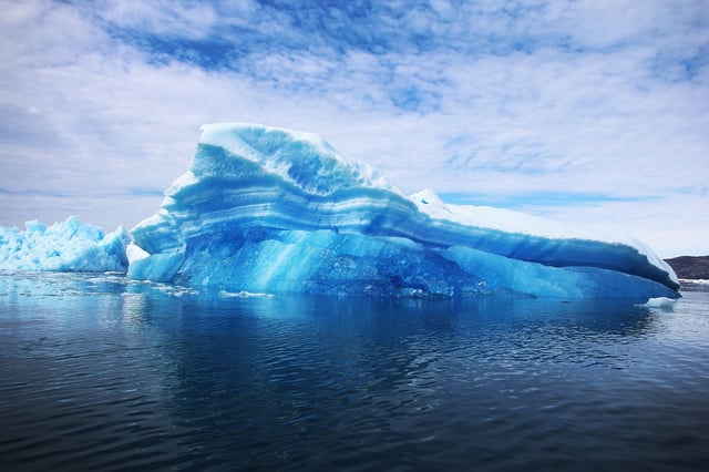 QAQORTOQ, GREENLAND - JULY 30:  Calved icebergs from the nearby Twin Glaciers are seen floating on the water on July 30, 2013 in Qaqortoq, Greenland. Boats are a crucial mode of transportation in the country that has few roads. As cities like Miami, New York and other vulnerable spots around the world strategize about how to respond to climate change, many Greenlanders simply do what theyve always done: adapt.  "Were used to change, said Greenlander Pilu Neilsen. "We learn to adapt to whatever comes. If all the glaciers melt, well just get more land.  (Photo by Joe Raedle/Getty Images)