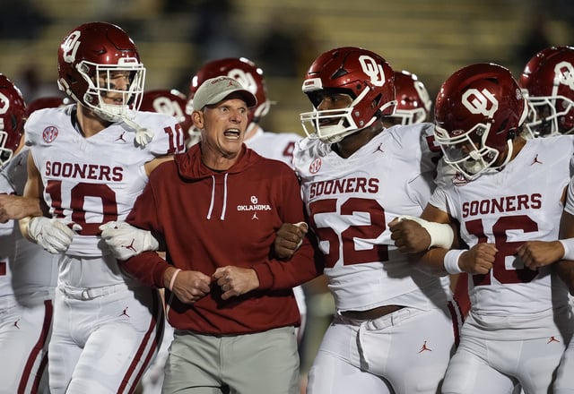 Nov 9, 2024; Columbia, Missouri, USA; Oklahoma Sooners head coach Brent Venables locks arms with his team prior to a game against the Missouri Tigers at Faurot Field at Memorial Stadium. Mandatory Credit: Jay Biggerstaff-Imagn Images/File Photo
