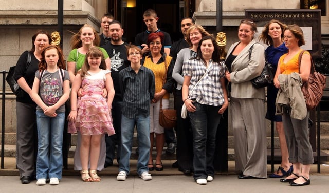 Some of the families who brought legal action against Corby Borough Council (Photo: Oli Scarff/Getty)