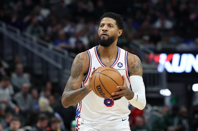 Paul George #8 of the Philadelphia 76ers takes a shot during a game against the Milwaukee Bucks at Fiserv Forum on February 09, 2025 in Milwaukee, Wisconsin.