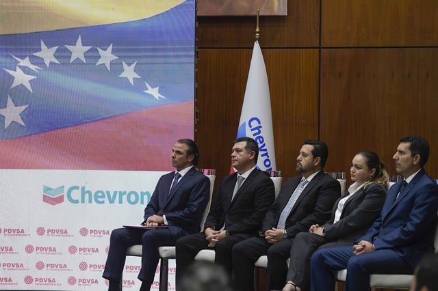 FILE - Chevron President in Venezuela, Javier La Rosa, left, attends a signing agreement ceremony between Venezuela and the California-based Chevron, in Caracas, Venezuela, Dec. 2, 2022. (AP Photo/Matias Delacroix, File)