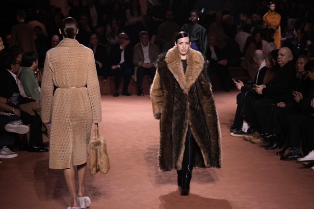 Models wear creations of the Fendi Fall/Winter 2025-2026 women's collection presented in Milan, Italy, Wednesday, Feb. 26, 2025. (AP Photo/Luca Bruno)