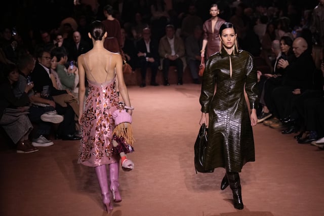 Models wear creations of the Fendi Fall/Winter 2025-2026 women's collection presented in Milan, Italy, Wednesday, Feb. 26, 2025. (AP Photo/Luca Bruno)