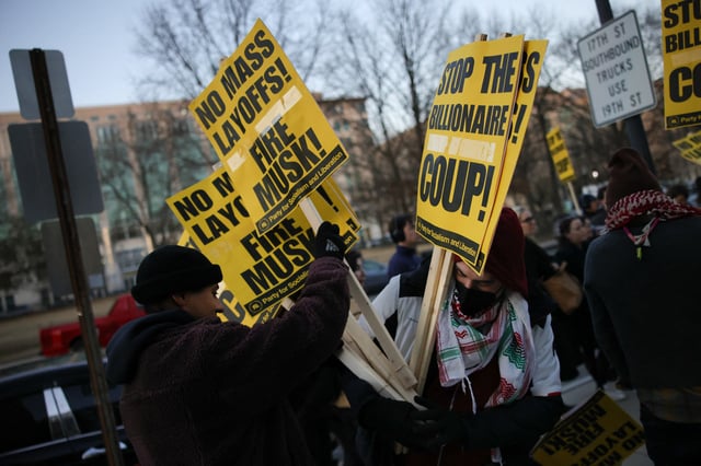 Protesters demonstrate outside of the Office of Personnel Management in Washington, D.C., on February 7, 2025, to demand the termination of Elon Musk from the Department of Government Efficiency (DOGE).