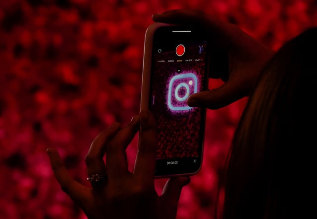 A logo of mobile application Instagram is seen on a mobile phone, during a conference in Mumbai, India, September 20, 2023. REUTERS/Francis Mascarenhas/File Photo