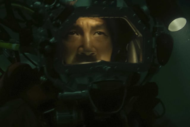 Dave (Simu Liu) takes a dive in the North Sea in the suspense film “Last Breath.”