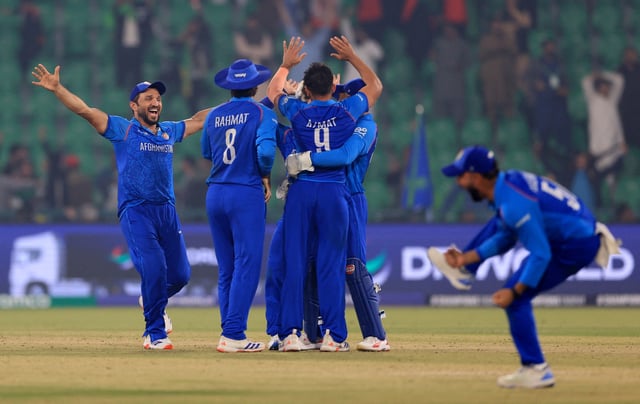 Cricket - ICC Men's Champions Trophy - Group B - England v Afghanistan - Gaddafi Stadium, Lahore, Pakistan - February 26, 2025 Afghanistan players celebrate after winning the match REUTERS/Akhtar Soomro
