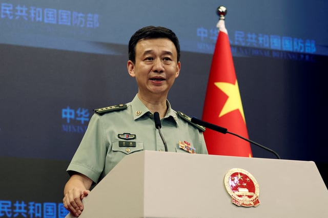 Chinese Defence Ministry spokesperson Wu Qian attends a press briefing in Beijing, China August 31, 2023. REUTERS/Yew Lun Tian/File Photo
