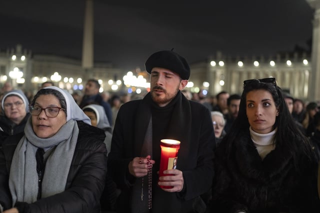 Catholic faithful attend a nightly rosary prayer service for the health of Pope Francis in St. Peter's Square at the Vatican. (AP Photo/Mosa'ab Elshamy)