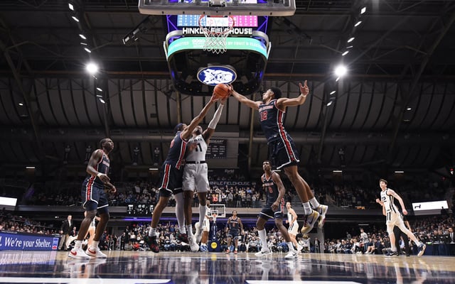 Feb 26, 2025; Indianapolis, Indiana, USA; St. John's Red Storm guard Aaron Scott (0), St. John's Red Storm guard RJ Luis Jr. (12) and Butler Bulldogs forward Jahmyl Telfort (11) go for a rebound during the second half at Hinkle Fieldhouse. Mandatory Credit: Robert Goddin-Imagn Images