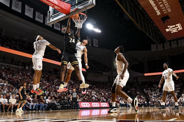 Feb 26, 2025; College Station, Texas, USA; Vanderbilt Commodores forward JaQualon Roberts (24) dunks the ball during the second half against the Texas A&M Aggies at Reed Arena. Mandatory Credit: Maria Lysaker-Imagn Images