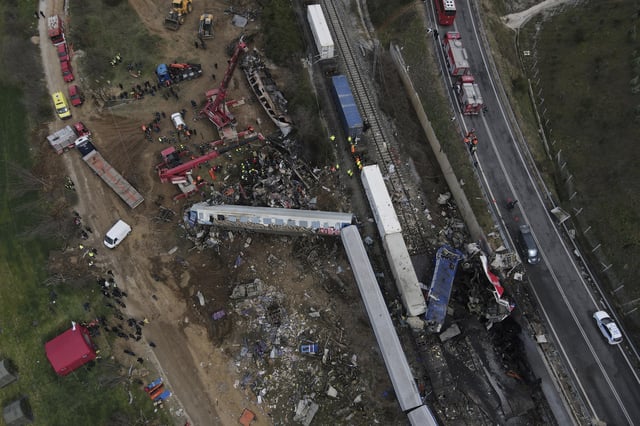FILE - Crane, firefighters and rescuers operate after a collision, that killed 57 people, in Tempe, about 376 kilometres (235 miles) north of Athens, near Larissa city, Greece, Wednesday, March 1, 2023. (AP Photo/Giannis Papanikos, File)