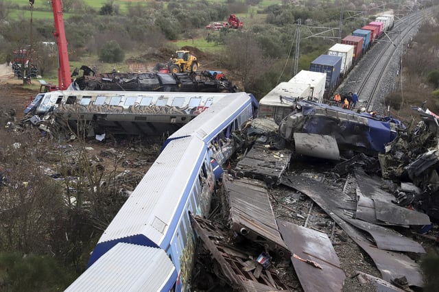 FILE - A crane, firefighters and rescuers operate after a collision, that killed 57 people, in Tempe, about 376 kilometres (235 miles) north of Athens, near Larissa city, Greece, Wednesday, March 1, 2023. (AP Photo/Vaggelis Kousioras, File)