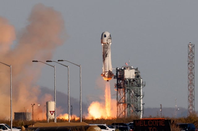 The Blue Origin New Shepard rocket lifts off with a crew of six from Launch Site One in west Texas, on December 11, 2021.