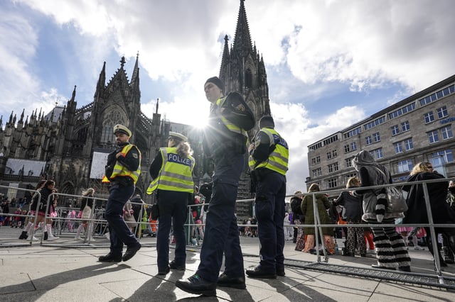 Police secures the start of the street carnival in Cologne, Germany, Thursday, Feb. 27, 2025. (AP Photo/Martin Meissner)