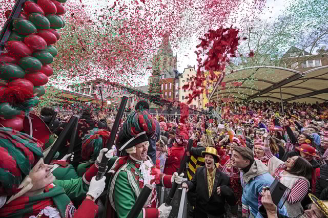 Revellers celebrate the start of the street carnival at the Alter Markt (Old Marketplace) in Cologne, Germany, Thursday, Feb. 27, 2025. (AP Photo/Martin Meissner)