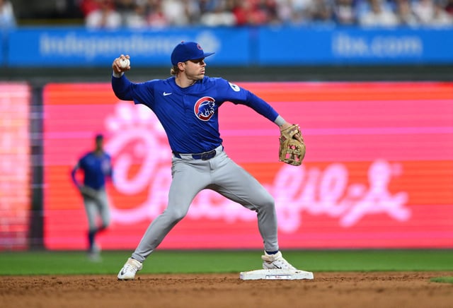 Sep 24, 2024; Philadelphia, Pennsylvania, USA; Chicago Cubs infielder Nico Hoerner (2) turns a double play against the Philadelphia Phillies in the sixth inning at Citizens Bank Park. Mandatory Credit: Kyle Ross-Imagn Images/File Photo