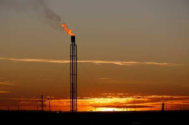 A flare burns excess natural gas in the Permian Basin in Loving County, Texas, U.S. November 23, 2019. Picture taken November 23, 2019.  REUTERS/Angus Mordant/File Photo