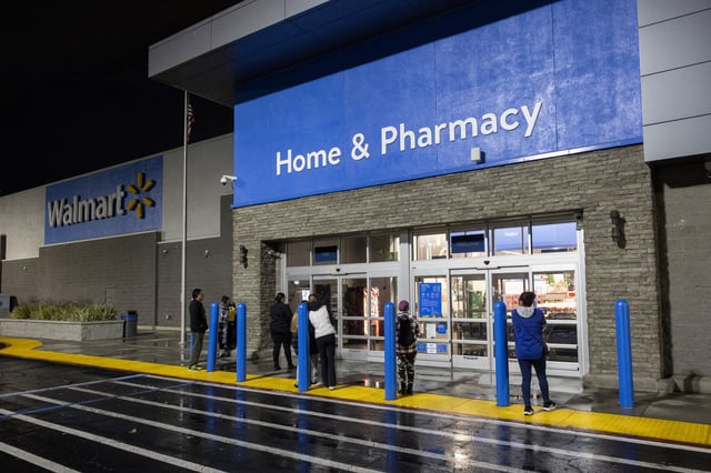 People wait for a Walmart store to open on Black Friday in Downey, California, November 29, 2024.