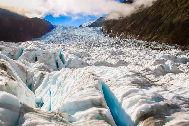 Glaciers, like the one seen here, may have once carved through the Earth's crust similar to how they can carve valleys in rock today. (PositiveTravelArt/Shutterstock)