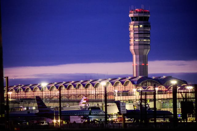 The air traffic control tower and some American Airlines planes are pictured at the Ronald Reagan Washington National Airport, in the aftermath of the collision of American Eagle flight 5342 and a Black Hawk helicopter that crashed into the Potomac River, in Washington, U.S., February 2, 2025. REUTERS/Eduardo Munoz/File Photo