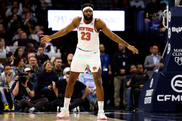 Mitchell Robinson #23 of the New York Knicks readies for play against the Minnesota Timberwolves in the fourth quarter at Target Center on November 20, 2023 in Minneapolis, Minnesota. The Timberwolves defeated the Knicks 117-100.