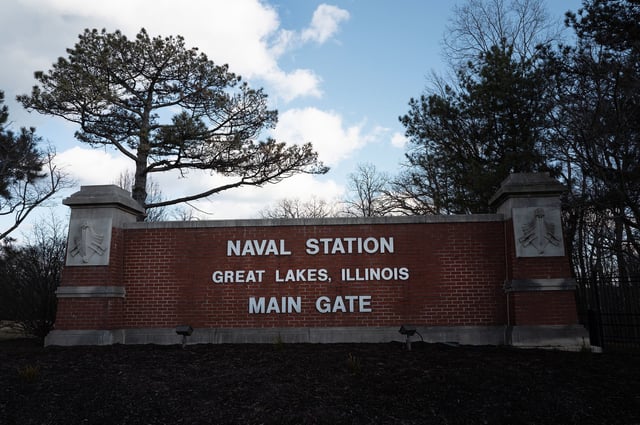A sign marks the main gate at Naval Station Great Lakes in Great Lakes, Illinois, on February 27, 2025. Xuanyu Harry Pang, 38, a former sailor once stationed at Great Lakes, has pleaded guilty to a 2022 conspiracy to carry out a terrorist attack at the facility on behalf of Iran’s Islamic Revolutionary Guard Corps.