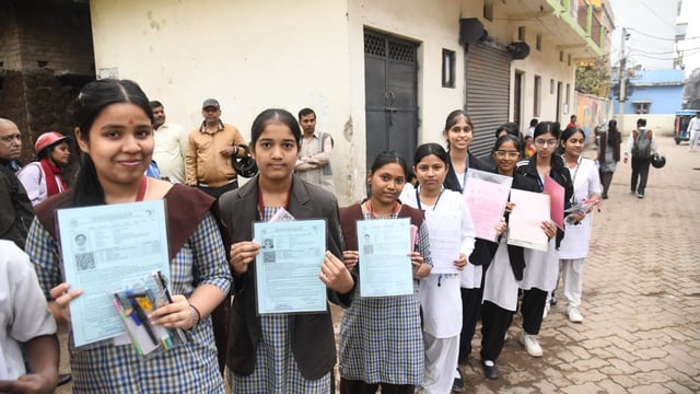 Students entering an examination centre to  appear in the Central Board of Secondary Education(CBSE )class 10th examination at St. Dominic savio's high school Danapur in patna. 