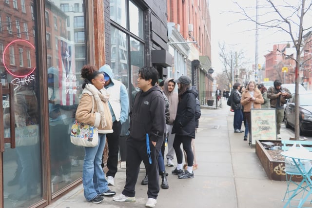 Customers line up out the door at Buddies Coffee after its owner said online she fears her hard work will be undone by increased rent and competition next door.