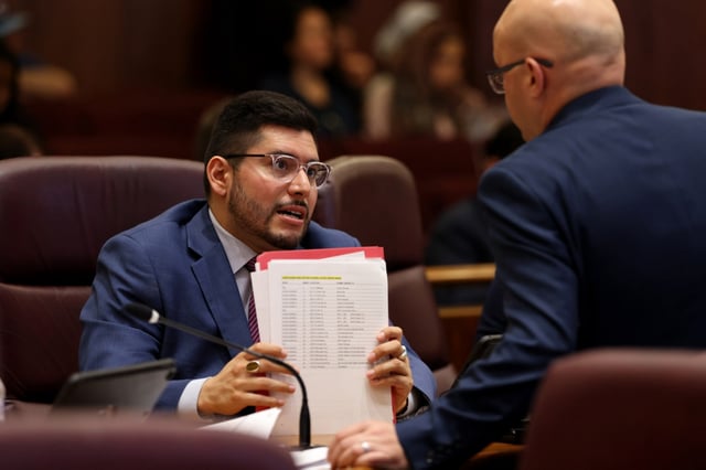 Ald. Carlos Ramirez Rosa speaks with Ald. Michael Rodriguez during a city council meeting at City Hall on May 22, 2024. (Antonio Perez/Chicago Tribune)