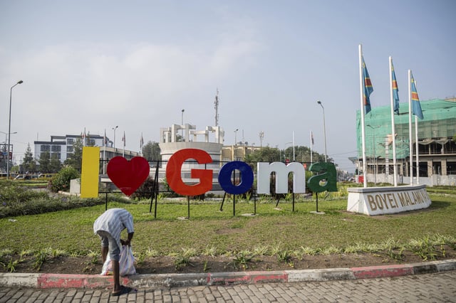 A municipal worker cleans a traffic circle in downtown Goma, Democratic Republic of Congo, Thursday, Feb. 27, 2025, one month after the city was captured by Rwanda-backed M23 rebels. (AP Photo/Moses Sawasawa)
