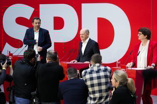 From left: Lars Klingbeil, co-leader of the Social Democratic Party (SPD), German Chancellor Olaf Scholz and Saskia Esken, co-leader of the SPD attend a news conference at the Social Democratic Party (SPD) headquarters in Berlin, Germany, Monday, Feb. 24, 2025. (AP Photo/Ebrahim Noroozi)