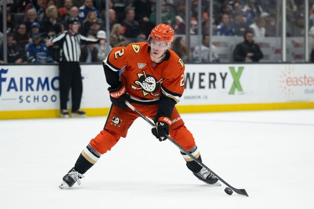 Ducks defenseman Jackson LaCombe controls the puck during against the Vancouver Canucks on Thursday, Feb. 27, 2025, at Honda Center. (AP Photo/Kyusung Gong)