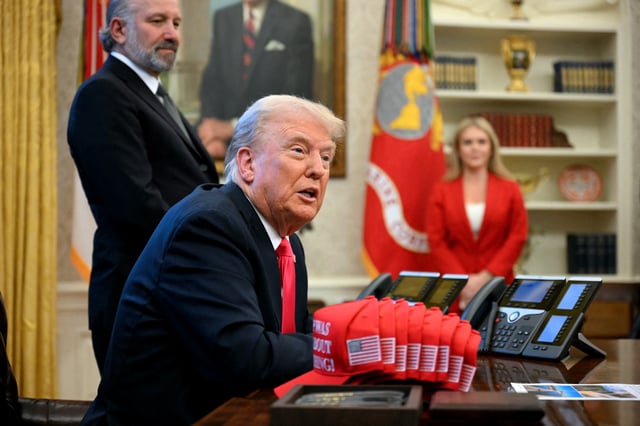US President Donald Trump speaks to the press alongside hats reading &#34;Trump was right about everything&#34;, after signing an Executive Order at the Oval Office of the White House in Washington, DC on February 25, 2025.