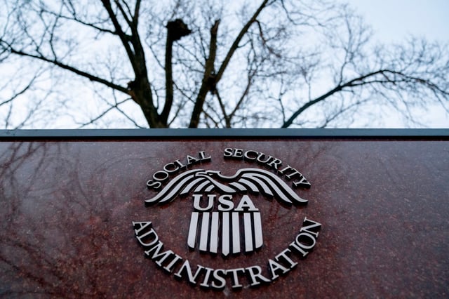 The seal of the US Social Security Administration outside the agencys headquarters in Woodlawn, Maryland, US, on Wednesday, Feb. 19, 2025. The acting commissioner of the Social Security Administration and her top deputy have left following a confrontation with Elon Musk's Department of Government Efficiency team over access to data on 70 million beneficiaries, according to people familiar with the moves. Photographer: Stefani Reynolds/Bloomberg