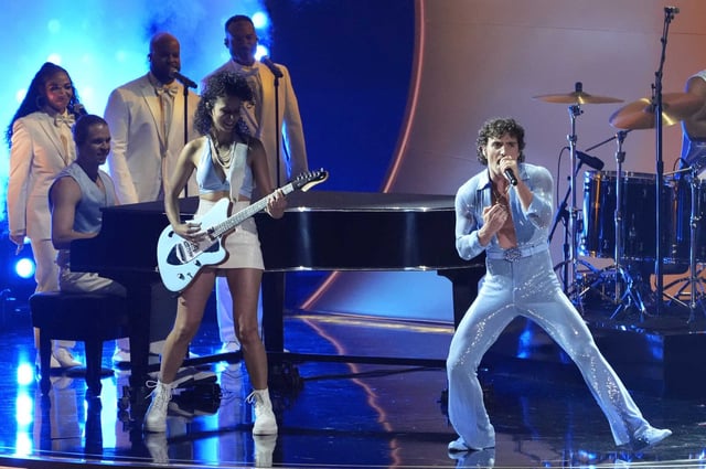 Benson Boone performs during the 67th Grammy Awards at Crypto.com Arena in Los Angeles on Feb. 2. Mark Zuckerberg surprised his wife, Priscilla Chan, on her 40th birthday by taking the stage in the same tight baby-blue jumpsuit.