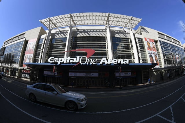 FILE - An exterior view of Capital One Arena is seen Saturday, March 16, 2019, in Washington. Capital One Arena is home to the Washington Capitals NHL hockey team and Washington Wizards NBA basketball team. A person with knowledge of the sale tells The Associated Press the Qatar Investment Authority is buying a 5% stake of the parent company of the NBA&#39;s Washington Wizards and NHL&#39;s Washington Capitals for $4.05 billion. It is believed to be the first time the government of Qatar is investing in North American professional sports.  (AP Photo/Nick Wass)