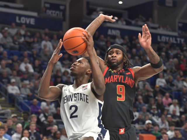 Penn State&#39;s D&#39;Marco Dunn (2) drives to the basket on Maryland&#39;s Selton Miguel (9) during the first half of an NCAA college basketball game Saturday, March 1, 2025, in State College, Pa. (AP Photo/Gary M. Baranec)
