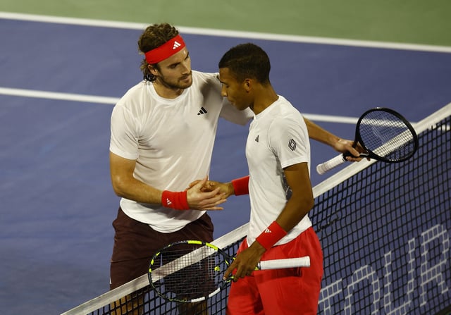 Tennis - Dubai Championships - Dubai Tennis Stadium, Dubai, United Arab Emirates - March 1, 2025 Greece's Stefanos Tsitsipas and Canada's Felix Auger Aliassime shake hands after their final match REUTERS/Rula Rouhana