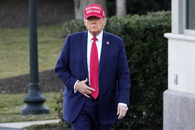 President Donald Trump walks before talking with reporters then boarding Marine One on the South Lawn of the White House in Washington, Friday, Feb. 28, 2025. (AP Photo/Ben Curtis)