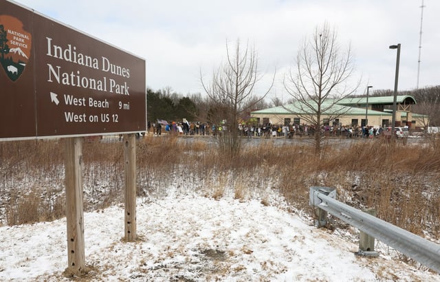 Demonstrators gather for a rally to protest ongoing National Park Service cuts outside the Indiana Dunes Visitor Center Saturday, March 1, 2025, in Porter, Indiana. (John J. Kim/Chicago Tribune)