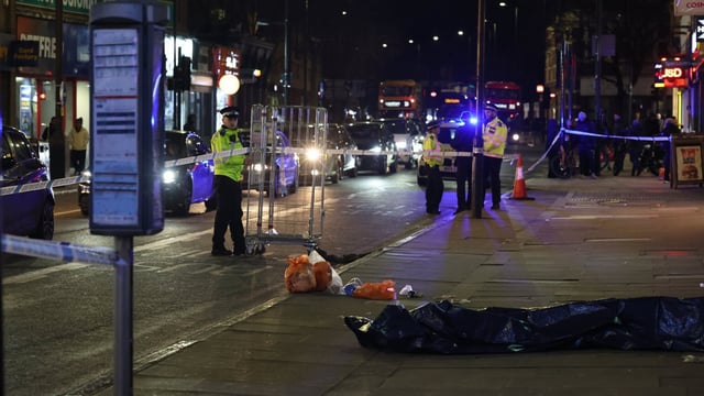 Police at the scene of the alleged attack on Seven Sisters Road in Islington