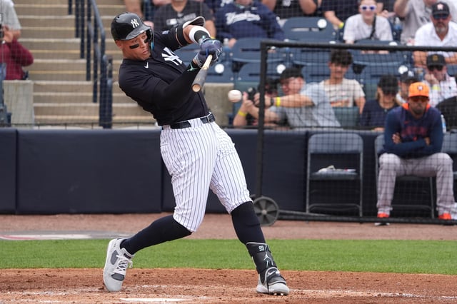 Mar 1, 2025; Tampa, Florida, USA; New York Yankees outfielder Aaron Judge (99) hits a two run rbi against the Houston Astros during the third inning at George M. Steinbrenner Field. Mandatory Credit: Dave Nelson-Imagn Images