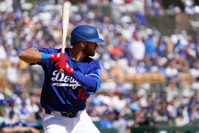 Mar 1, 2025; Phoenix, Arizona, USA; Los Angeles Dodgers second baseman David Bote (12) bats against the San Francisco Giants during the third inning at Camelback Ranch-Glendale. Mandatory Credit: Joe Camporeale-Imagn Images